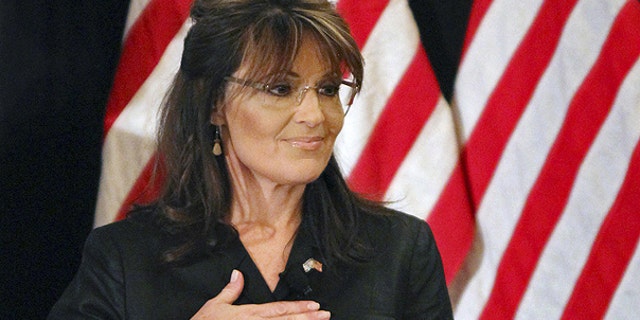 Feb. 17: Former Alaska Gov. Sarah Palin covers her heart during the national anthem as she attends a public appearance at a Long Island Association (LIA) meeting and luncheon in Woodbury, N.Y.