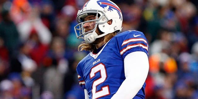 Dec 22, 2013; Orchard Park, NY, USA; Buffalo Bills kicker Dan Carpenter (2) kicks a field goal as punter Brian Moorman (8) holds during the second half against the Miami Dolphins at Ralph Wilson Stadium. Bills beat the Dolphins 19-0. Mandatory Credit: Kevin Hoffman-USA TODAY Sports