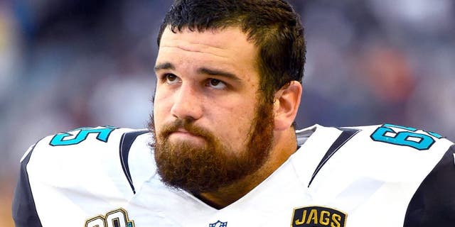 Aug 14, 2014; Chicago, IL, USA; Jacksonville Jaguars offensive guard Brandon Linder (65) during the first quarter of the preseason game at Soldier Field. Mandatory Credit: Mike DiNovo-USA TODAY Sports