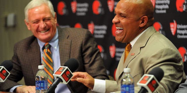 Jan 13, 2016; Berea, OH, USA; Cleveland Browns owner Jimmy Haslam (left) and new head coach Hue Jackson talk during a press conference at the Cleveland Browns training facility. Mandatory Credit: Ken Blaze-USA TODAY Sports