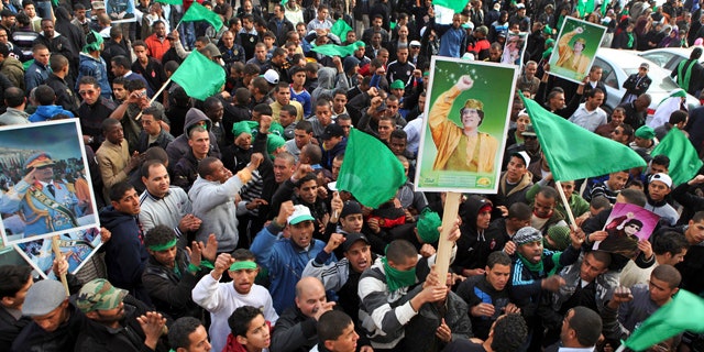 Feb. 18: Pro-Gadhafi supporters gather in Green Square after traditional Friday prayers in Tripoli, Libya.