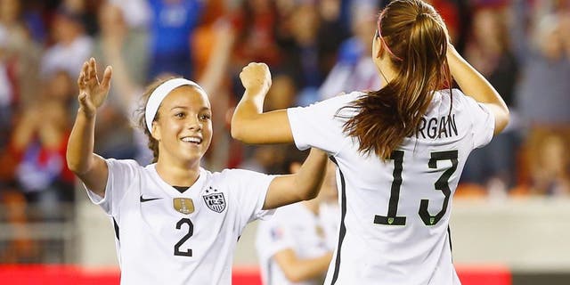 HOUSTON, TX - FEBRUARY 19: Mallory Pugh #2 and Alex Morgan #13 of the United States celebrate after Morgan scored a goal in the first half of their game against Trinidad and Tobago during their Semifinal of the 2016 CONCACAF Women's Olympic Qualifying at BBVA Compass Stadium on February 19, 2016 in Houston, Texas. (Photo by Scott Halleran/Getty Images)