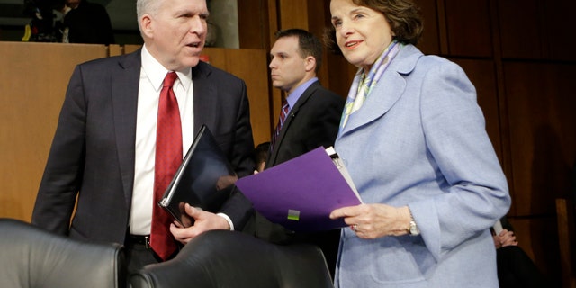 FILE - In this Feb. 7, 2013 file photo, Senate Intelligence Committee Chair Sen. Dianne Feinstein, D-Calif., right, welcomes CIA Director nominee John Brennan on Capitol Hill in Washington, prior to the start of Brennan's confirmation hearing before the committee. Lawmakers are considering whether Congress can set up a court to decide when drones can kill U.S. citizens overseas, much like the secret courts that now grant permission for surveillance. It's another sign of the U.S. philosophical struggle over remote warfare, raised after CIA head nominee John Brennan's vigorous defense of the drones. (AP Photo/J. Scott Applewhite, File)