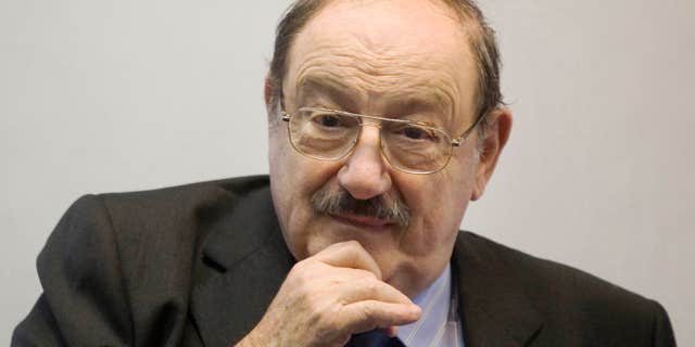 FILE - In a Wednesday, Feb. 23, 2011 file photo, Italian writer Umberto Eco gestures as he speaks during a press conference at the 25th Annual Book Fair in Jerusalem.