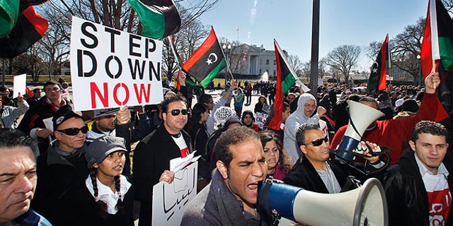 Feb. 19: Protesters demand the ouster of Libyan leader Qaddafi in front of the White House in Washington.