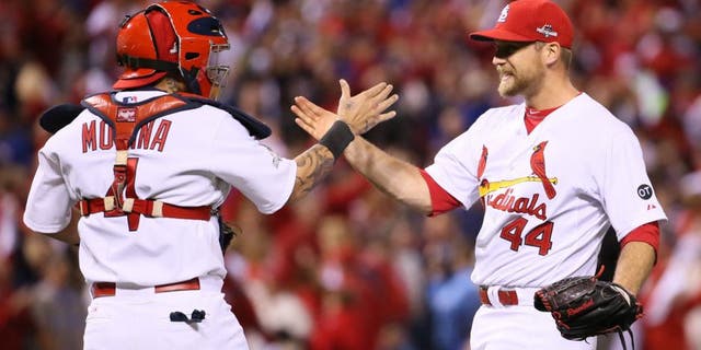 St. Louis Cardinals closer Trevor Rosenthal, right, celebrates with catcher Yadier Molina after preserving the shutout victory in the ninth inning against the Chicago Cubs in Game 1 of the NLDS on Friday, Oct. 9, 2015, at Busch Stadium in St. Louis. The Cards won, 4-0. (Chris Lee/St. Louis Post-Dispatch/TNS via Getty Images)