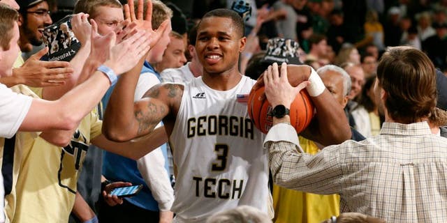 Feb 20, 2016; Atlanta, GA, USA; Georgia Tech Yellow Jackets Marcus Georges-Hunt (3) celebrates with fans after defeating the Notre Dame Fighting Irish 63-62 at McCamish Pavilion. Mandatory Credit: Jason Getz-USA TODAY Sports