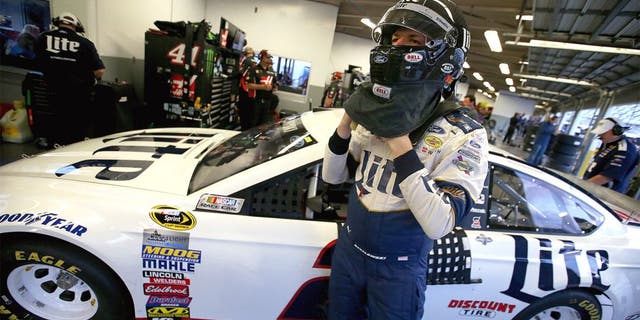 DAYTONA BEACH, FL - FEBRUARY 17: Brad Keselowski, driver of the #2 Miller Lite Ford, stands in the garage area during practice for the Daytona 500 at Daytona International Speedway on February 17, 2016 in Daytona Beach, Florida. (Photo by Sean Gardner/Getty Images)