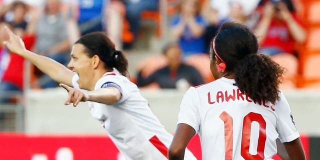 HOUSTON, TX - FEBRUARY 19: Christine Sinclair #12 of Canada celebrates after scoring a second half goal against Costa Rica during the Semifinal of the 2016 CONCACAF Women's Olympic Qualifying at BBVA Compass Stadium on February 19, 2016 in Houston, Texas. (Photo by Scott Halleran/Getty Images)
