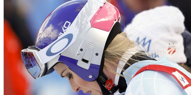 United States' Lindsey Vonn reacts after crashing during a women's Alpine ski downhill race, in La Thuile, Italy, Friday, Feb. 19, 2016. (AP Photo/Alessandro Trovati)