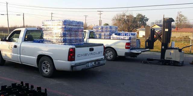 Crystal City officials delivering water to residents.