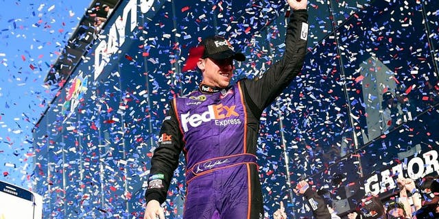 DAYTONA BEACH, FL - FEBRUARY 21: Denny Hamlin, driver of the #11 FedEx Express Toyota, celebrates in Victory Lane after winning the NASCAR Sprint Cup Series DAYTONA 500 at Daytona International Speedway on February 21, 2016 in Daytona Beach, Florida. (Photo by Jared C. Tilton/Getty Images)