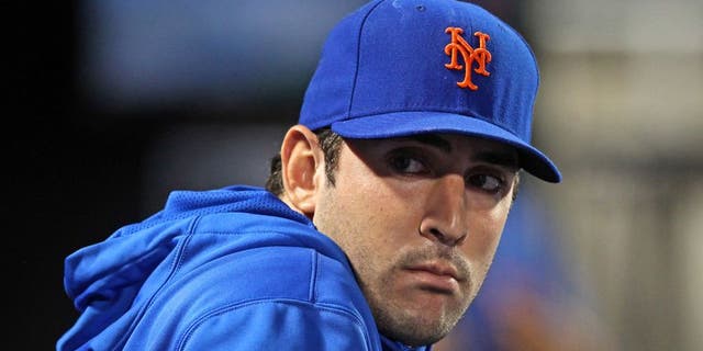 Sep 9, 2013; New York, NY, USA; New York Mets injured starting pitcher Matt Harvey (33) looks on from the dugout during the sixth inning of a game against the Washington Nationals at Citi Field. Mandatory Credit: Brad Penner-USA TODAY Sports