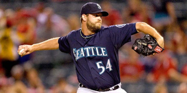 ANAHEIM, CA - SEPTEMBER 16: Tom Wilhelmsen #54 of the Seattle Mariners pitches during the game against the Los Angeles Angels of Anaheim on September 16, 2014 at Angel Stadium of Anaheim in Anaheim, California. (Photo by Matt Brown/Angels Baseball LP/Getty Images)