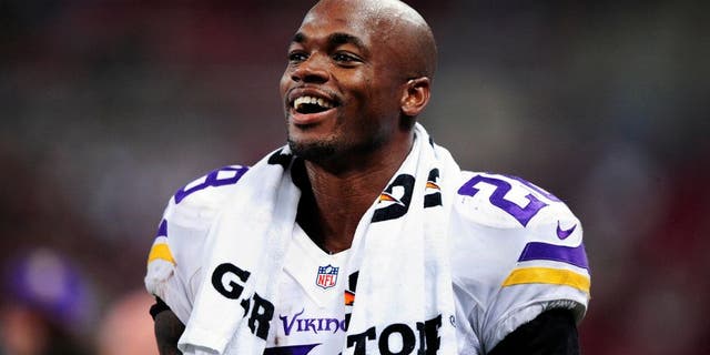 Sep 7, 2014; St. Louis, MO, USA; Minnesota Vikings running back Adrian Peterson (28) looks on during the second half against the St. Louis Rams at the Edward Jones Dome. The Vikings defeated the Rams 34-6. Mandatory Credit: Jeff Curry-USA TODAY Sports