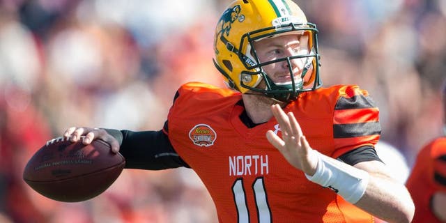 MOBILE, AL - JANUARY 30: North team's quarterback Carson Wentz #11 with North Dakota State looks to throw a pass during their game against the South Team on January 30, 2016 at Ladd-Peebles Stadium in Mobile, Alabama. (Photo by Michael Chang/Getty Images)