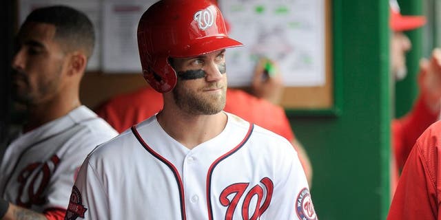 WASHINGTON, DC - SEPTEMBER 27: Bryce Harper #34 of the Washington Nationals watches the game against the Philadelphia Phillies at Nationals Park on September 27, 2015 in Washington, DC. (Photo by G Fiume/Getty Images)
