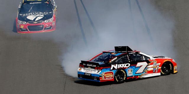 DAYTONA BEACH, FL - FEBRUARY 21: Regan Smith, driver of the #7 Nikko RC/Golden Corral Chevrolet, has an on track incident during the NASCAR Sprint Cup Series DAYTONA 500 at Daytona International Speedway on February 21, 2016 in Daytona Beach, Florida. (Photo by Brian Lawdermilk/Getty Images)