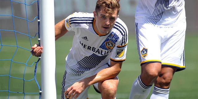 August 9, 2015; Carson, CA, USA; Los Angeles Galaxy midfielder Robbie Rogers (14) reacts after making a defensive play against Seattle Sounders during the second half at StubHub Center. Mandatory Credit: Gary A. Vasquez-USA TODAY Sports