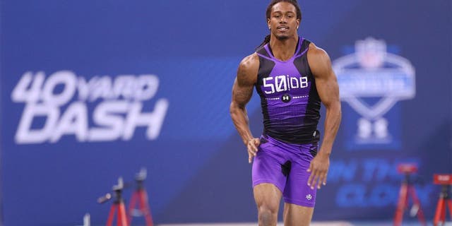 Feb 23, 2015; Indianapolis, IN, USA; Michigan State Spartans defensive back Trae Waynes runs the 40 yard dash and crosses the finish line with all the stop watch timers during the 2015 NFL Combine at Lucas Oil Stadium. Mandatory Credit: Brian Spurlock-USA TODAY Sports