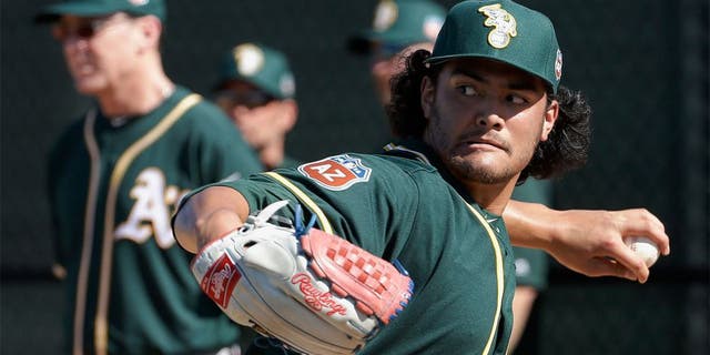Oakland Athletics pitcher Sean Manaea throws during spring training baseball practice in Mesa, Ariz., Sunday, Feb. 21, 2016. (AP Photo/Chris Carlson)