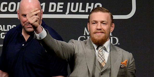 RIO DE JANEIRO, BRAZIL - MARCH 20: UFC featherweight champion Jose Aldo of Brazil (L) and challenger Conor McGregor of Irleland face off as UFC President Dana White (C) stands in during the 189 World Media Tour Launch press conference at Maracanazinho, at Maracanazinho on March 20, 2015 in Rio de Janeiro, Brazil. (Photo by Alexandre Loureiro/Zuffa LLC/Zuffa LLC via Getty Images)
