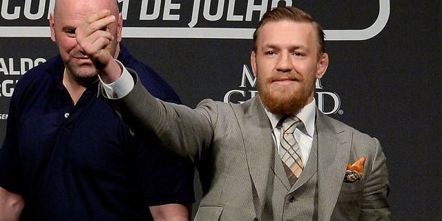 RIO DE JANEIRO, BRAZIL - MARCH 20: UFC featherweight champion Jose Aldo of Brazil (L) and challenger Conor McGregor of Irleland face off as UFC President Dana White (C) stands in during the 189 World Media Tour Launch press conference at Maracanazinho, at Maracanazinho on March 20, 2015 in Rio de Janeiro, Brazil. (Photo by Alexandre Loureiro/Zuffa LLC/Zuffa LLC via Getty Images)