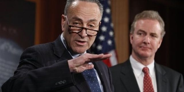 Sen. Charles Schumer, D-N.Y., left,  accompanied by Rep. Chris Van Hollen, D-Md., gestures during a  news conference introducing a bill to undo the Supreme Court's Citizens United ruling, Thursday, Feb. 11, 2010, on Capitol Hill in Washington.  (AP Photo/Manuel Balce Ceneta)
