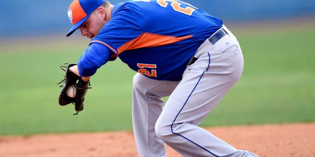 Feb 23, 2015; Port St. Lucie, FL, USA; New York Mets first baseman Lucas Duda (21) fields a ground ball during spring training at Tradition Field. Mandatory Credit: Brad Barr-USA TODAY Sports