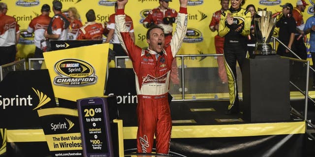 HOMESTEAD, FL - NOVEMBER 16: Kevin Harvick, driver of the #4 Budweiser Chevrolet, celebrates in victory lane after winning during the NASCAR Sprint Cup Series Ford EcoBoost 400 at Homestead-Miami Speedway on November 16, 2014 in Homestead, Florida.