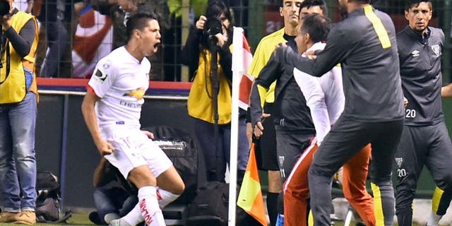 Ecuador's Liga de Quito Diego Morales (L) celebrates his goal against San Lorenzo during their Copa Libertadores football match at Casa Blanca stadium in Quito, on February 23, 2016. AFP PHOTO / RODRIGO BUENDIA / AFP / RODRIGO BUENDIA (Photo credit should read RODRIGO BUENDIA/AFP/Getty Images)
