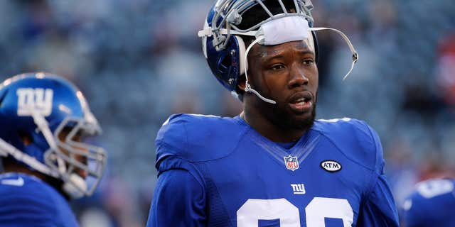 FILE - In this Jan. 3, 2016, file photo, New York Giants defensive end Jason Pierre-Paul (90) warms up before playing against the Philadelphia Eagles in an NFL football game in East Rutherford, N.J.