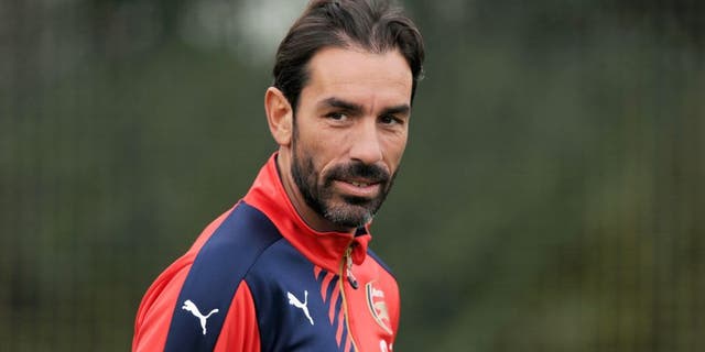 ST ALBANS, ENGLAND - OCTOBER 23: ex Arsenal player Robert Pires watches a training session at London Colney on October 23, 2015 in St Albans, England. (Photo by Stuart MacFarlane/Arsenal FC via Getty Images)