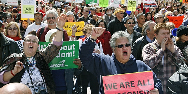 Feb. 26: Union worker Cindy Vasquez, right, of Los Angeles joins teachers and other public sector workers as they rally in solidarity with Wisconsin workers outside Los Angeles City Hall.