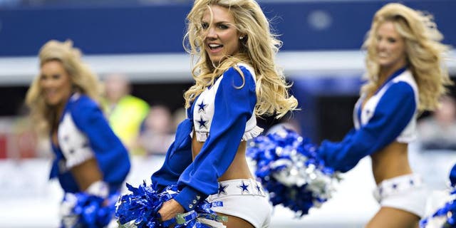 ARLINGTON, TX - NOVEMBER 02: Cheerleaders of the Dallas Cowboys perform before a game against the Arizona Cardinals at AT&T Stadium on November 2, 2014 in Arlington, Texas. The Cardinals defeated the Cowboys 28-17. (Photo by Wesley Hitt/Getty Images)
