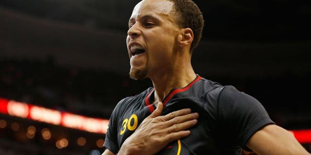 Feb 24, 2015; Washington, DC, USA; Golden State Warriors guard Stephen Curry (30) gestures on the court against the Washington Wizards in the third quarter at Verizon Center. The Warriors won 114-107. Mandatory Credit: Geoff Burke-USA TODAY Sports