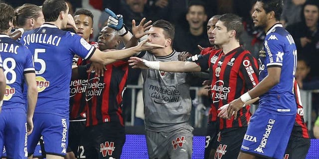 Players of both teams clash during the French L1 football match Nice (OGC Nice) vs Bastia (SCB) on February 26, 2016 at the "Allianz Riviera" stadium in Nice, southeastern France. AFP PHOTO / VALERY HACHE / AFP / VALERY HACHE (Photo credit should read VALERY HACHE/AFP/Getty Images)