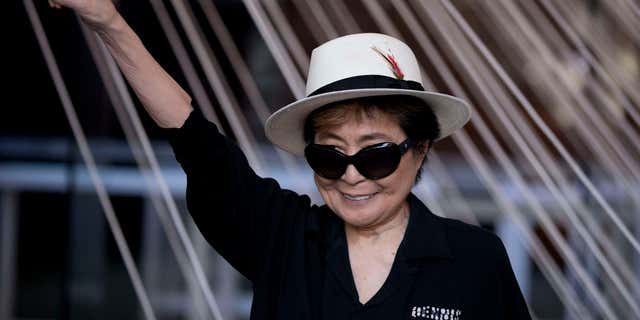 Feb. 2, 2016: Yoko Ono poses for photographers in front of a work entitled "Morning Beams/River Bed," at a press event to mark the opening of her exhibiition "Land of Hope" at the Museum of Memory and Tolerance in Mexico City.