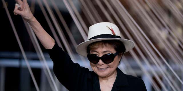 Feb. 2, 2016: Yoko Ono poses for photographers in front of a work entitled "Morning Beams/River Bed," at a press event to mark the opening of her exhibiition "Land of Hope" at the Museum of Memory and Tolerance in Mexico City.