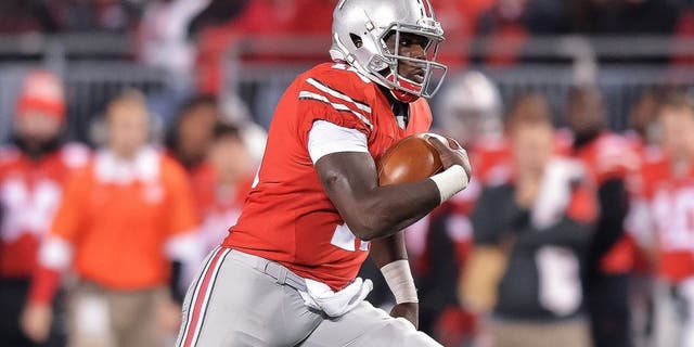COLUMBUS, OH - NOVEMBER 7: Quarterback Cardale Jones #12 of the Ohio State Buckeyes runs with the ball against the Minnesota Golden Gophers at Ohio Stadium on November 7, 2015 in Columbus, Ohio. (Photo by Jamie Sabau/Getty Images)