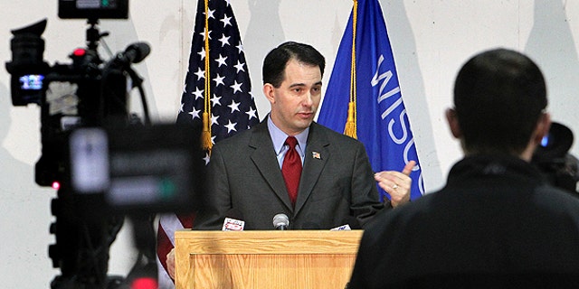 Feb. 28: Gov. Scott Walker addresses the media during a news conference at Colgan Air Services at the La Crosse Municipal Airport in La Crosse, Wis.