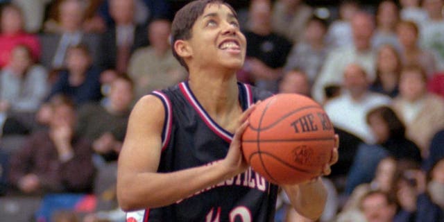Connecticut's Nykesha Sales shoots an uncontested lay-up to break the school's all-time scoring record against Villanova Tuesday, Feb. 24, 1998 in Villanova, Pa. Sales, who is out for the remainder of the season with a ruptured Achilles tendon, made the two points in a pre-arranged deal with Villanova. After scoring the points needed she left the court and Villanova made an uncontested shot to even the score at 2-2. (AP Photo/Chris Gardner)