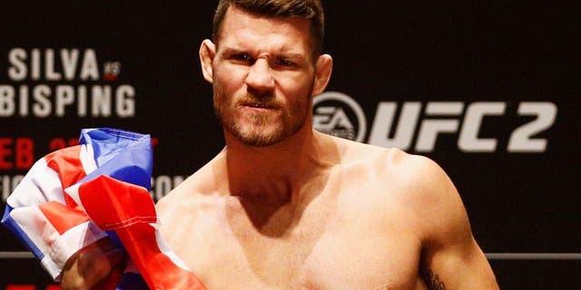 LONDON, ENGLAND - FEBRUARY 26: Michael 'The Count' Bisping of England celebrates on the scales on stage during the UFC Fight Night Weigh-in held at at Indigo at The O2 Arena on February 26, 2016 in London, England. Anderson 'The Spider' Silva of Brazil and Michael 'The Count' Bisping of England will fight tomorrow night in the O2 Arena. (Photo by Dean Mouhtaropoulos/Zuffa LLC/Zuffa LLC via Getty Images)