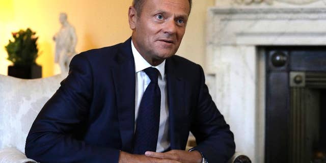 President of the European Council, Donald Tusk listens to Britain's Prime Minister Theresa May inside 10 Downing Street in London, Thursday, Sept. 8, 2016. The two met for a bilateral meeting to discuss Brexit, amid increasing pressure over a lack of detail in the Government's stated strategy. (AP Photo/Kirsty Wigglesworth, pool)