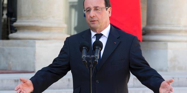 FILE - In this April 24, 2013 file photo, French President Francois Hollande talks to the media after the weekly cabinet meeting in Paris. The most unpopular president in France’s modern history, Francois Hollande, is preparing the ground for a potential re-election bid. The 61-year-old Socialist president has not formally announced his intention to run, but more and more signs are emerging that he’s in campaign mode. The government set the dates this week for the next election _ two rounds on April 23 and May 7, 2017. (AP Photo/Jacques Brinon, File)
