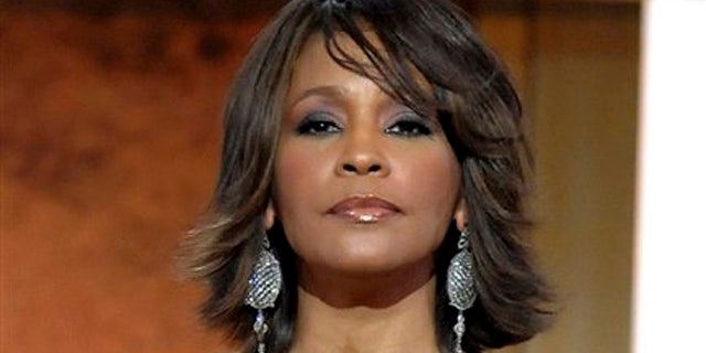 FILE - This Jan. 17, 2009 file photo shows singer Whitney Houston at the BET Honors in the Warner Theatre in Washington. Houston died Saturday, Feb. 11, 2012, she was 48. (AP Photo/Evan Agostini, File)