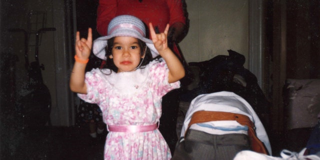 A precocious April Jeanette Mendez poses for the camera
