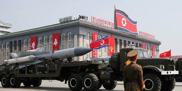 Missiles are driven past the stand with North Korean leader Kim Jong Un and other high ranking officials during a military parade marking the 105th birth anniversary of North Korea's founding father, Kim Il Sung, in Pyongyang, April 15, 2017. 