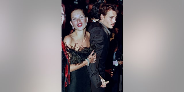 Kate Moss and Johnny Depp arrived at the official screening of the film "Fear and Loathing in Las Vegas" at the 51st Cannes Film Festival.