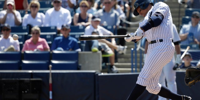New York Yankees' designated hitter Alex Rodriguez hits a single in the first inning during a spring training baseball exhibition game against the Philadelphia Phillies, Wednesday, March 4, 2015, in Tampa, Fla. (AP Photo/Lynne Sladky)